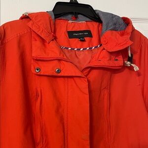 Jones New York vibrant orange utility/rain jacket with detachable button hood.